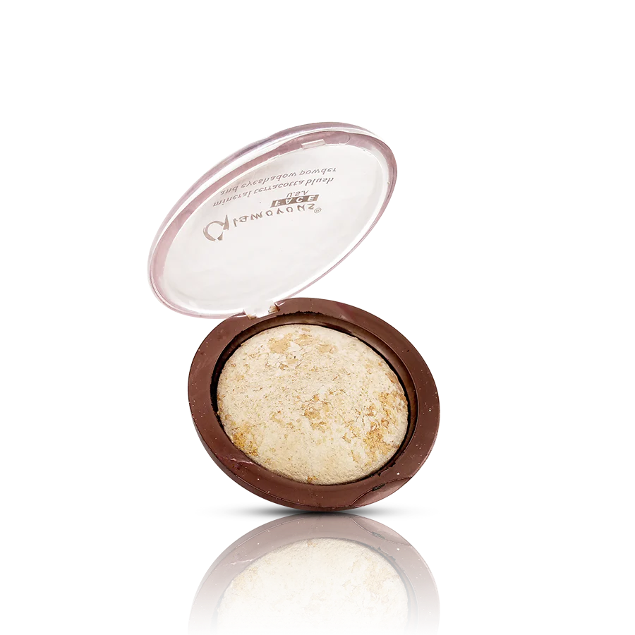 Compact makeup product with open lid on a white background