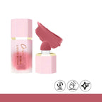 Pink liquid blush cream with applicator and swatch on a white background