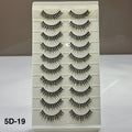 Set of false eyelashes on a display card with a neutral background