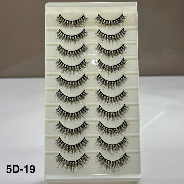 Set of false eyelashes on a display card with a neutral background