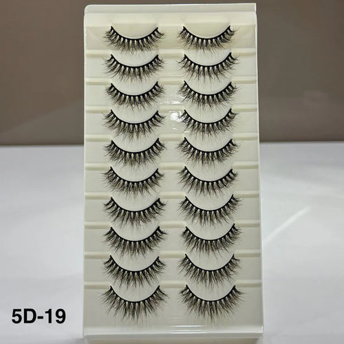 Set of false eyelashes on a display card with a neutral background