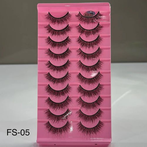 Set of false eyelashes in a pink case with a gray background