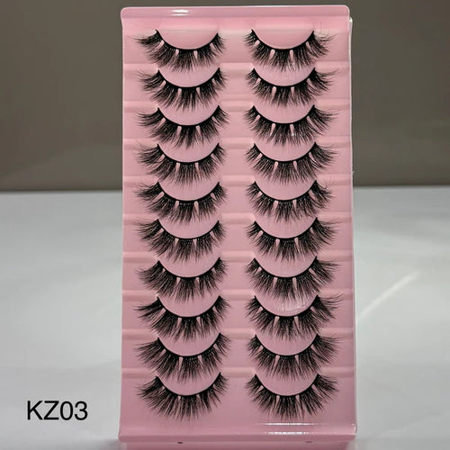 Pink tray with false eyelashes labeled KZ03 on a gray background
