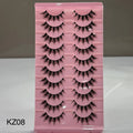Pink tray with false eyelashes labeled KZ08 on a gray background