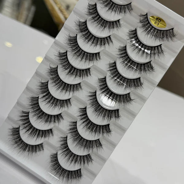 Set of false eyelashes on a white card with a gray pattern