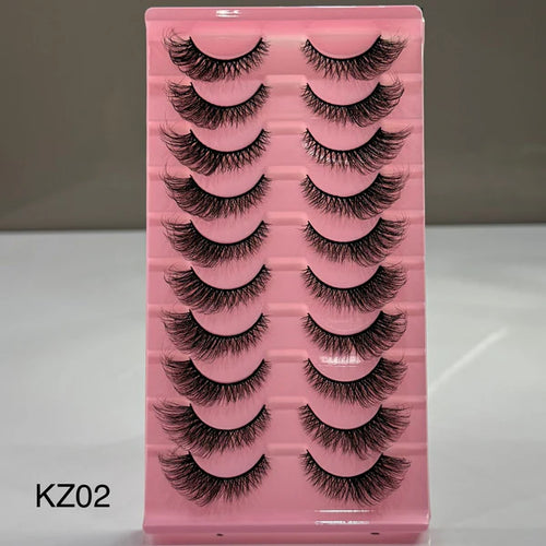 Pink tray with false eyelashes labeled KZ02 on a gray background
