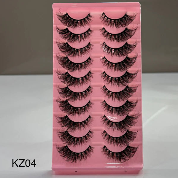 Pink tray with false eyelashes labeled KZ04 on a gray background