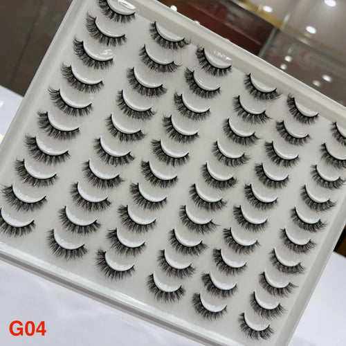 Set of false eyelashes on a tray with a clear background