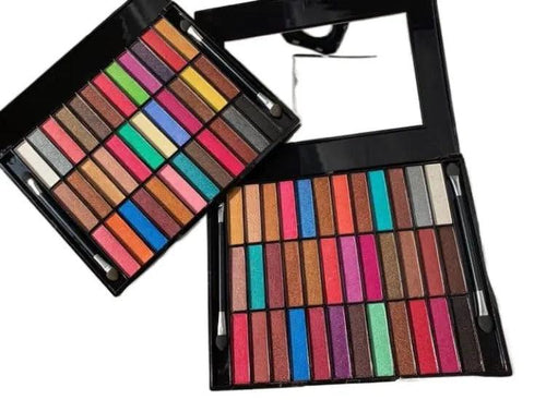Makeup palette with various colors on a white background
