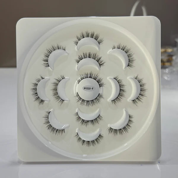 Set of false eyelashes in a white case with visible brand name.