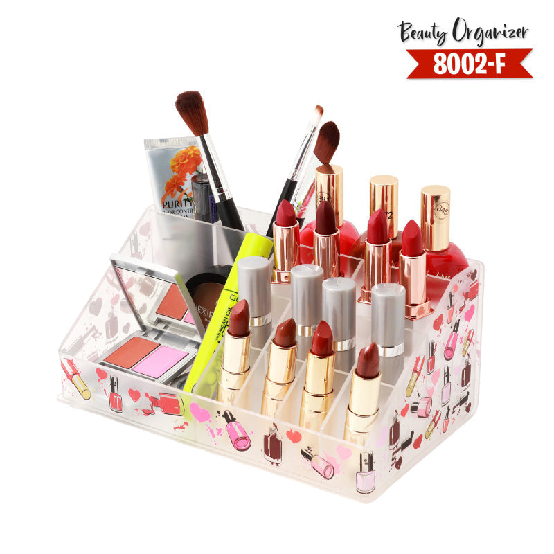 Makeup organizer with lipsticks, brushes, and other cosmetic items on a white background