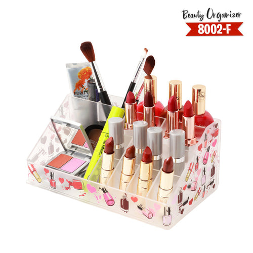 Makeup organizer with lipsticks, brushes, and other cosmetic items on a white background