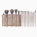 Set of makeup brushes with a beige pouch on a white background