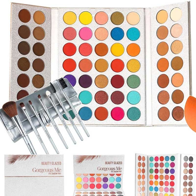 Makeup palette with brushes and additional palettes on a white background