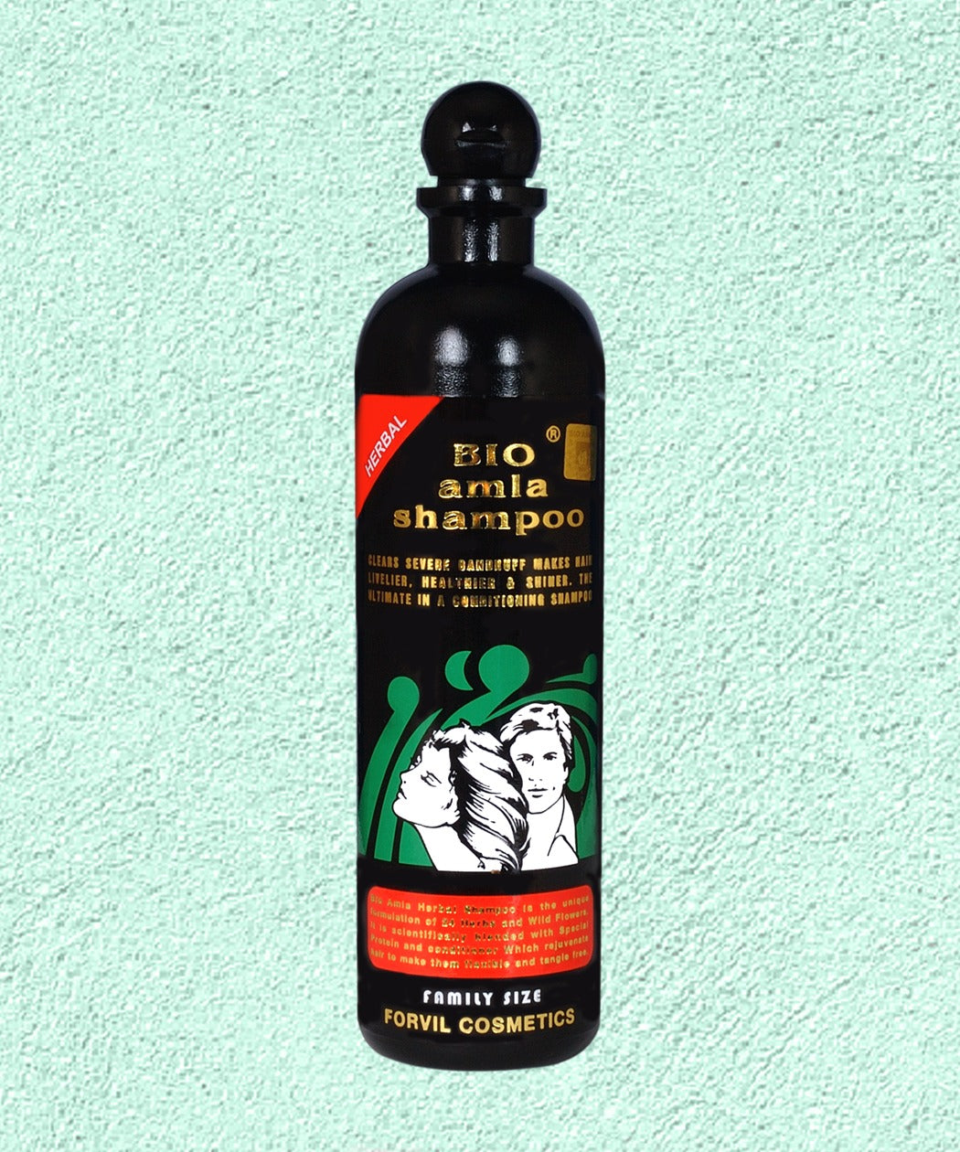Black shampoo bottle with a colorful label on a light green background