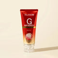 Blesso G Sensation Facial Foam in a red squeeze tube with a clear cap, set against a warm beige background.