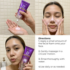 Person applying facial foam with a purple tube labeled 'B3 Sensation' in a bathroom setting.
