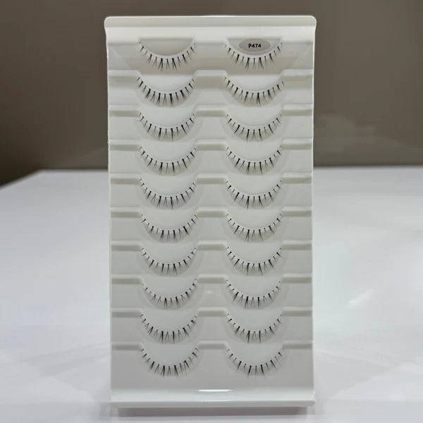 Eyelash display stand with multiple pairs of false eyelashes on a white background