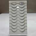 Set of false eyelashes in a white box with a grid pattern.