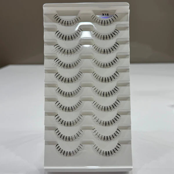 Set of false eyelashes in a white box with a grid pattern.