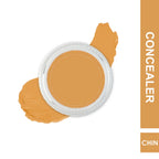 Concealer jar with applicator and swatch on a white background