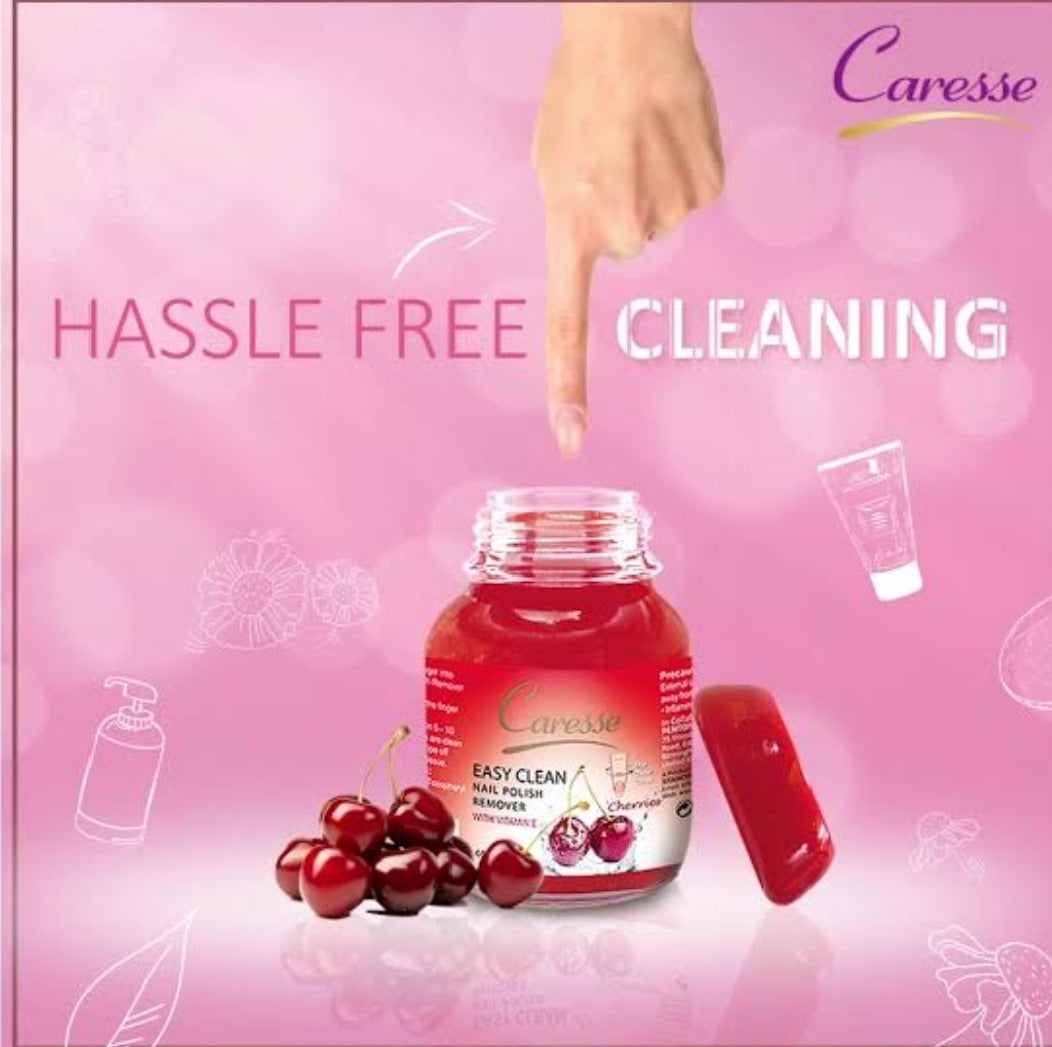 Caresse nail polish remover bottle with cherry design on a pink background, featuring the text 'Hassle Free Cleaning'.