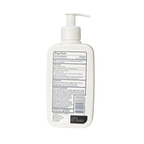 White bottle with pump and label on a white background