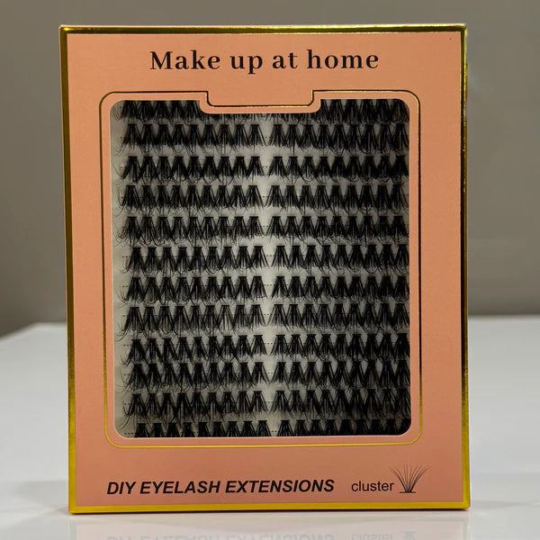 Box of DIY eyelash extensions with 'Make up at home' text on a neutral background