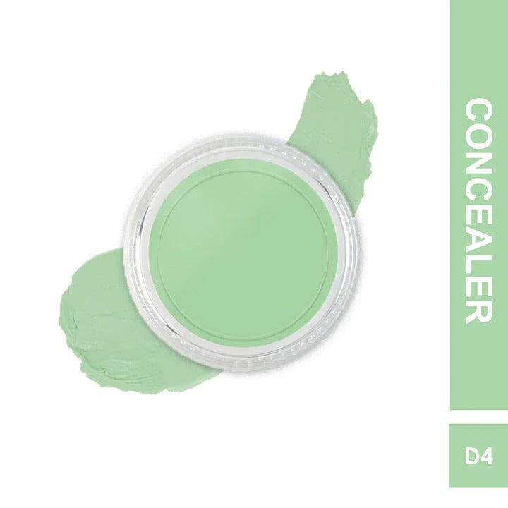 Green concealer with applicator on a white background