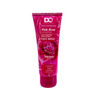 Pink tube of face wash with floral design on a white background