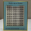 Eyelash extensions in a box with 'Make up at home' text on a neutral background