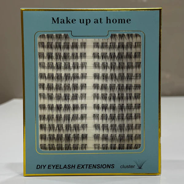 Packaged DIY eyelash extensions with a blue label on a neutral background