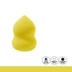 Yellow makeup sponge with icons labeled 'Pure Blend', 'Smooth Apply', and 'Flawless Blend' on a white background.