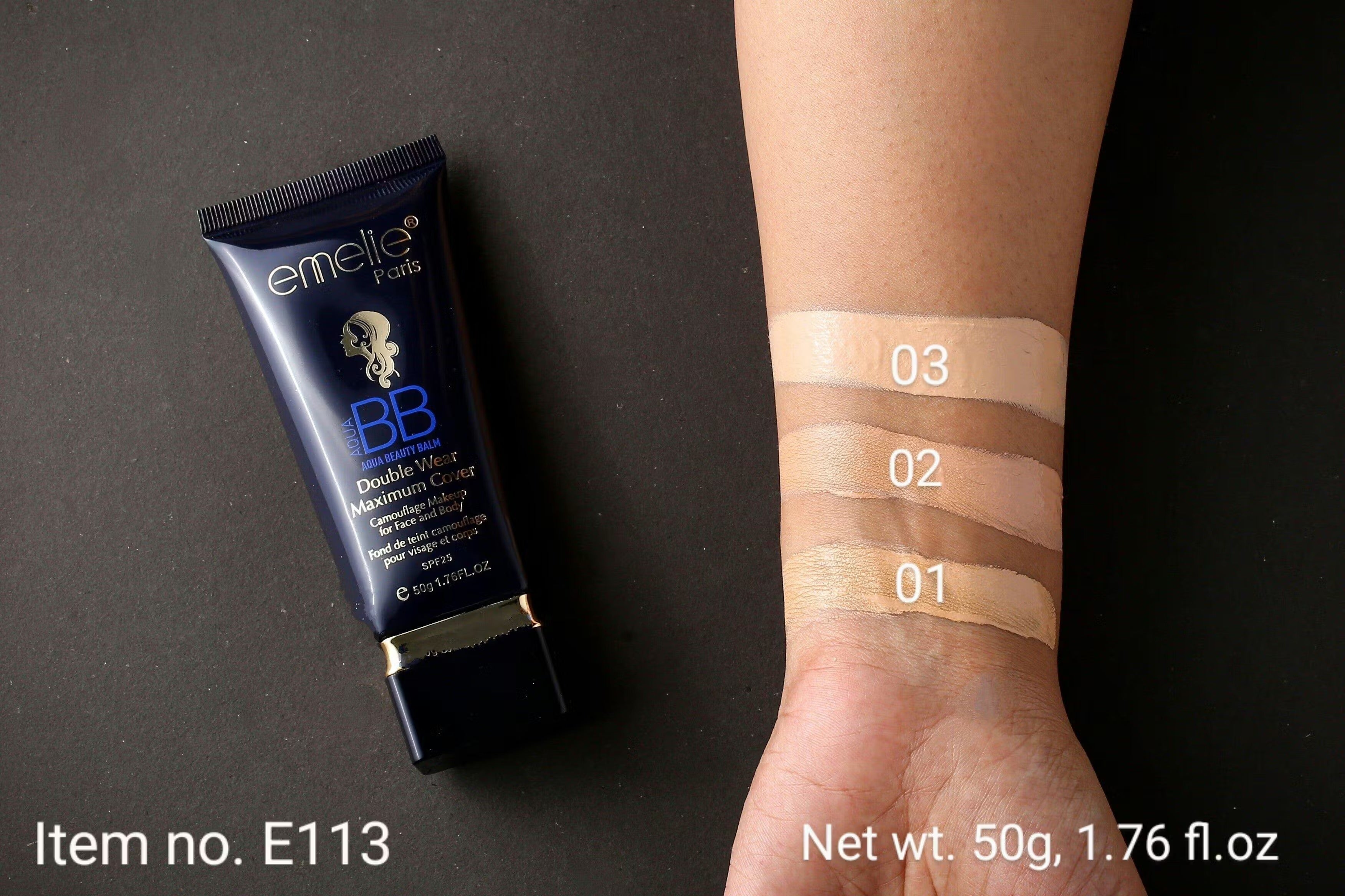 Emelle BB cream tube with swatches on a wrist against a dark background