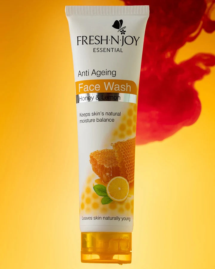 Fresh-N-Joy Anti Ageing Face Wash tube with honey and lemon graphics on a yellow background