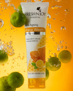 Fresh-N-Joy Anti-Ageing Face Wash tube with honeycomb and lemon graphics on a yellow background with green fruits.