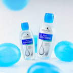 Two bottles of FreshnJoy Pure Glycerine on a light blue background with blue spherical objects.
