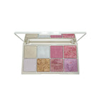 Makeup palette with various colored shades on a white background