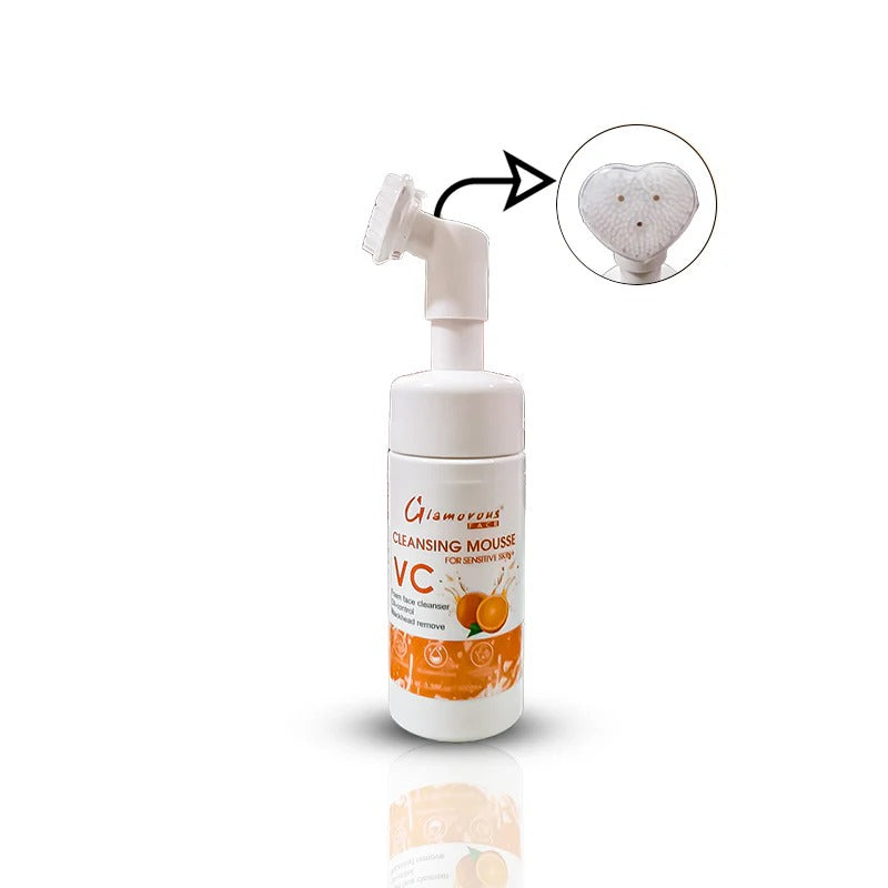 Cleansing mousse bottle with a heart-shaped applicator on a white background