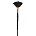 Makeup brush with black bristles and black handle on a white background