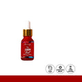 Red bottle with dropper labeled 'Cheek Tint' on a white background