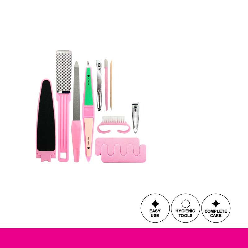 Set of nail care tools with pink handles on a white background