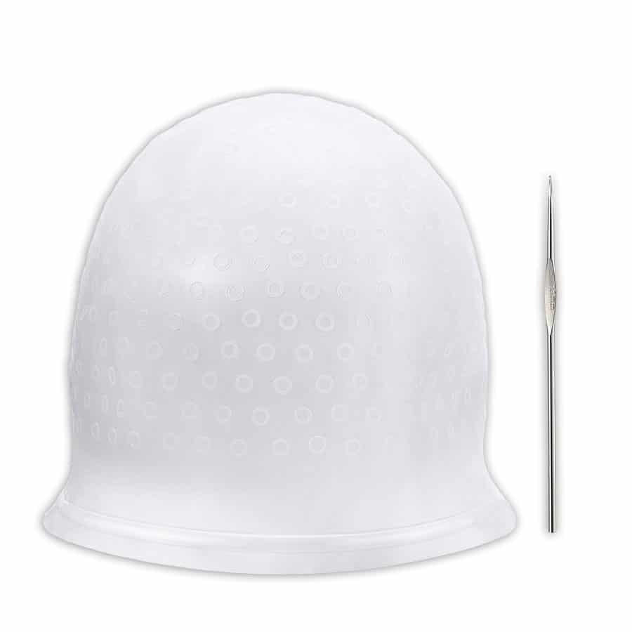 White plastic cap with small holes and a metal needle on a white background