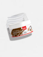 White jar of massage cream with a label on a light gray background