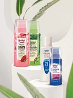 Collection of Golden Pearl skincare products on a white surface with green leaves in the background