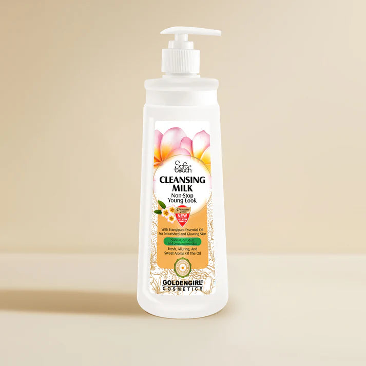 Bottle of Golden Girl Cleansing Milk with a pump on a beige background