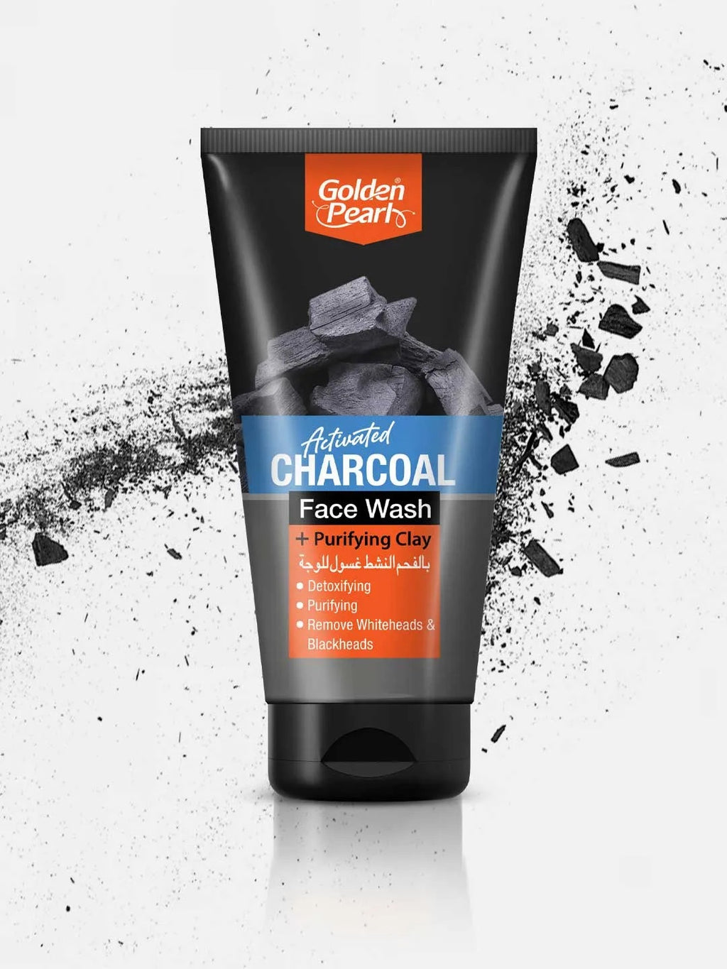 Tube of Golden Pearl Activated Charcoal Face Wash on a white background with black charcoal particles.