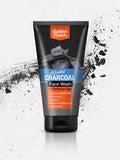 Tube of Golden Pearl Activated Charcoal Face Wash on a white background with black charcoal particles.