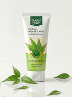 Tube of Golden Pearl Purifying Neem Face Wash with green leaves on a white background