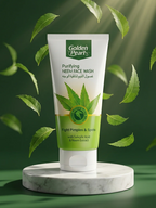 Tube of Golden Pearl Purifying Neem Face Wash with green leaves on a green background
